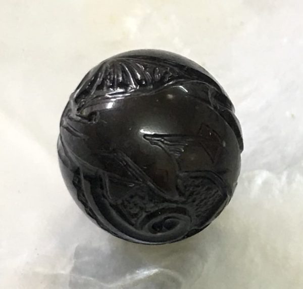 Carved Black Pearl with dolphin1 and Polynesian tattoo designs